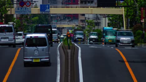 a timelapse of the traffic jam at the urban street in tokyo long shot