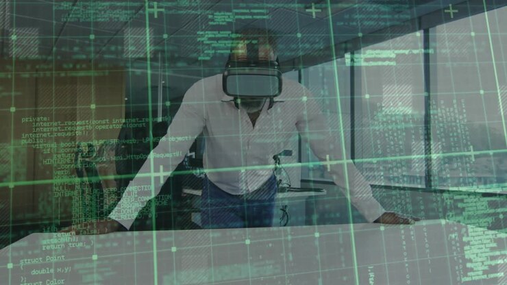 Mand, der tager VR-headset på, scanner virtuelt datanet og guider tech-demo, mens kollega observerer