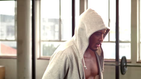 fit man wearing hooded jumper