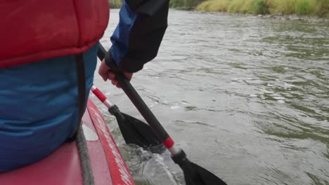 two paddlers on the raft swimming down the