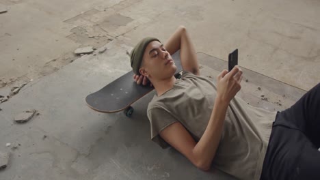 fashionable young man in an abandoned warehouse