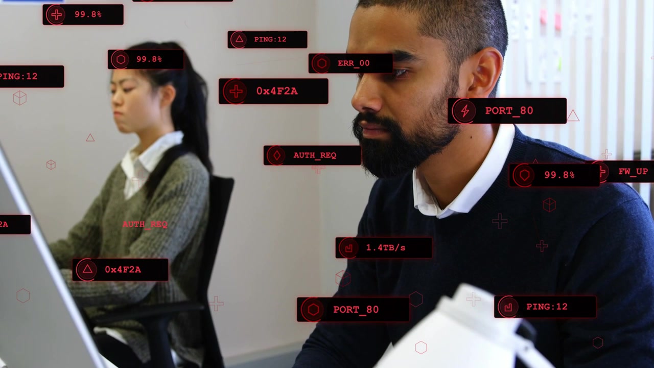 Bearded man typing and starting network scan while monitoring performance, red HUD labels expanding