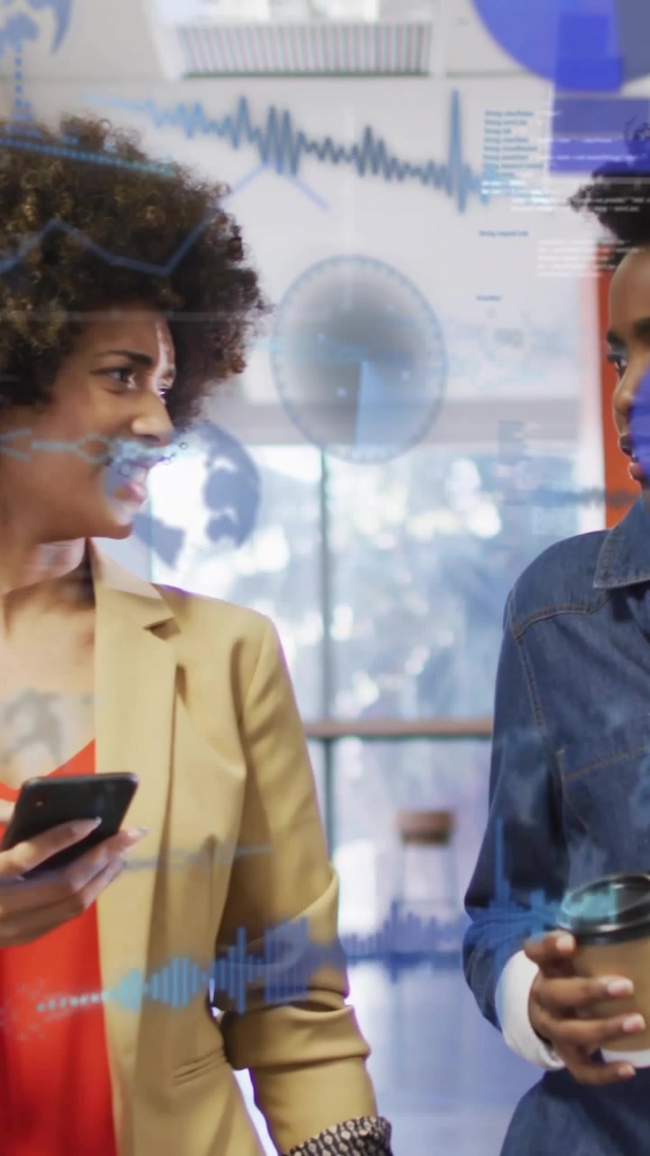 Vertical video: Two women walking, left woman tapping phone showing live data charts to review