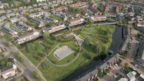 aerial tilt up from playground and revealing a beautiful suburban neighborhood