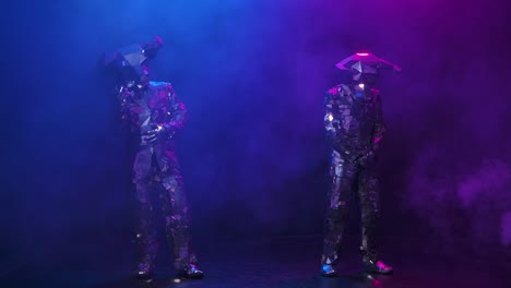 mirror-masked dancers on stage
