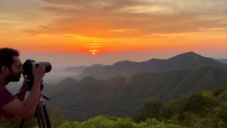photographer captures sunrise over mountain range