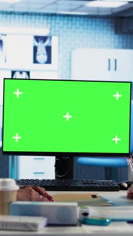 doctor's office scene with green screen monitor
