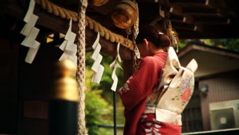 japanese woman in kimono at a shrine