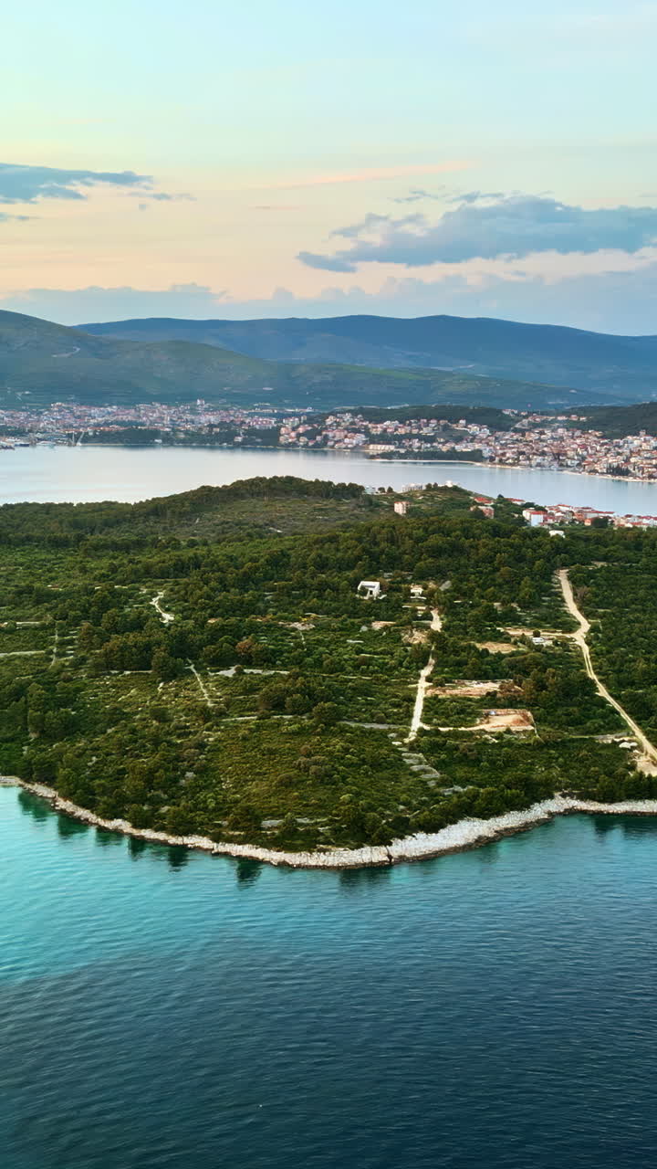 Aerial, drone view of buildings on the shore of the Adriatic sea in Croatia. Vertical