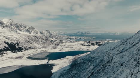 mountain ridges in winter landscape at lofoten archipelago near svolvaer, norway. aerial drone shot