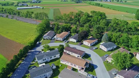 An-Aerial-View-of-a-Well-Kept-Mobile,-Manufactured,-Prefab-Home-Park-of-Single-Wide-and-Double-Wide-Houses-on-a-Sunny-Day