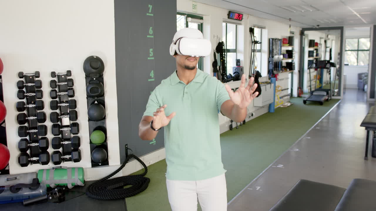 Man in rehabilitation center using VR headset for physical therapy exercises