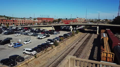 Aerial-shot-of-car-parked-under-the-bridge-in-the-city