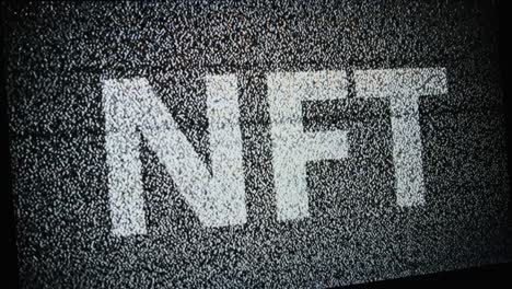 nft inscription on a monitor screen in white static white tv noise, no signal