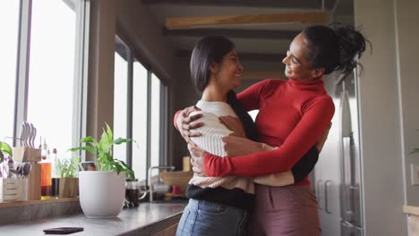 Video-of-happy-biracial-female-friends-embracing