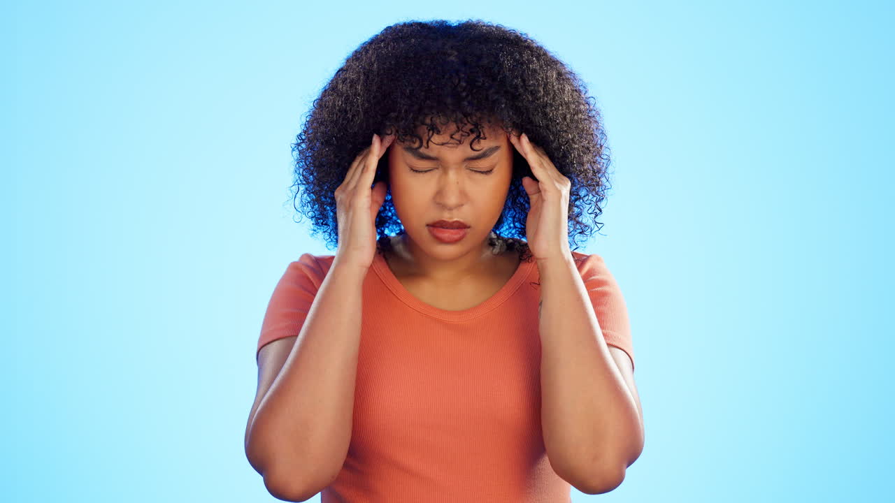 Woman, headache and face of pain in studio