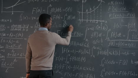 professor teaching mathematics on chalkboard