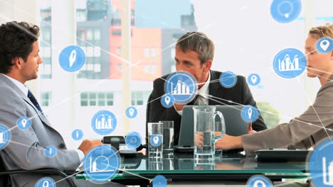 animation of network of digital icons against group of diverse colleagues discussing at office