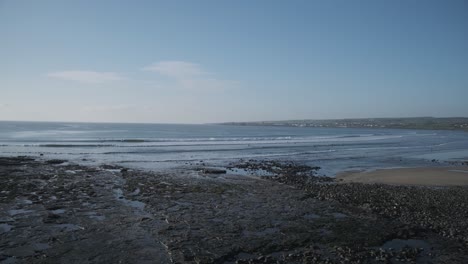 strip of irish coastline with waves coming in in beautiful patterns