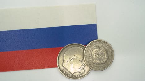 commemorative ussr or cccp 1 ruble lenin coin over a russian federation flag