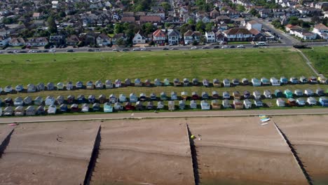 a dolly-right flyover of tankerton beach, with both a view of the beach houses and town