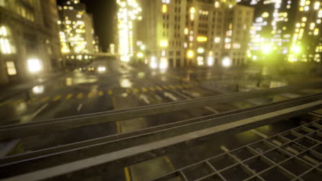 city at night with illuminated buildings and quiet streets observed from above