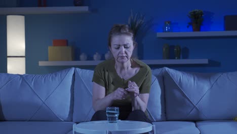 depressed woman is taking antidepressant pills.