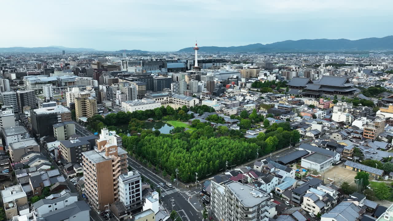 Shoseien Garden With Kyoto Tower In The Distance In Kyoto, Japan. - aerial shot