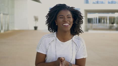 Happy-African-American-woman-talking-to-camera.