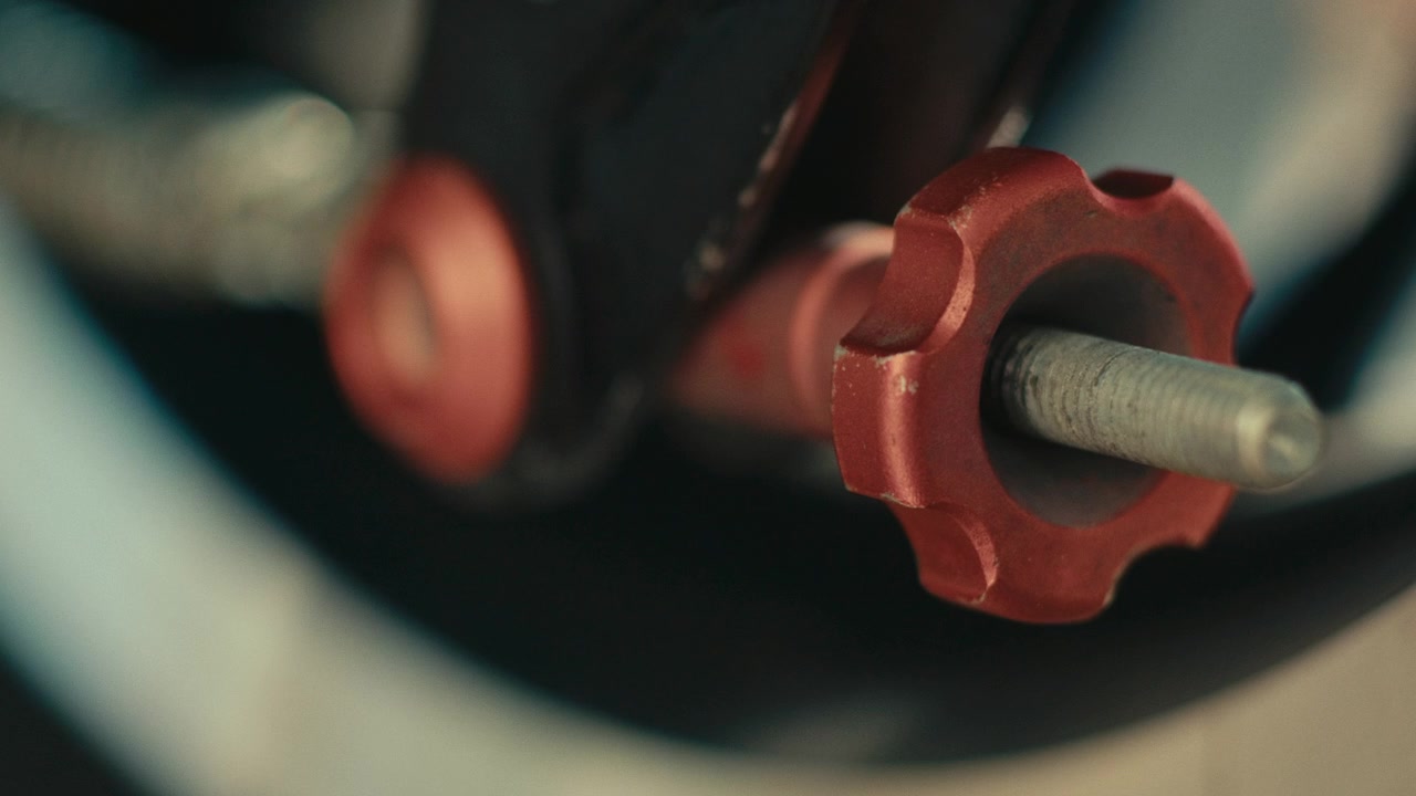 A Precision-crafted Bolt and Knob Embody the Engineering Excellence at the Heart of Racing - Close Up