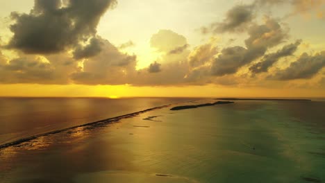 sunset, seychelles, open ocean, coral reefs dramatic sky, and calm seawater