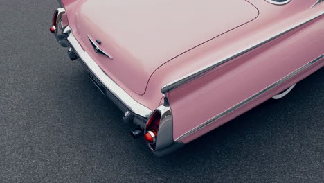 rear view of a pink vintage car with tail fins