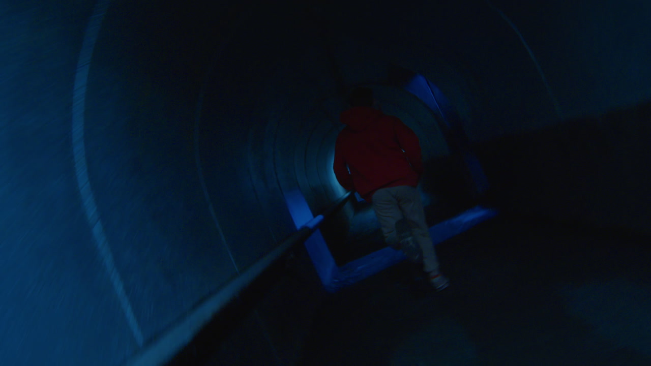 Man Running in Underground Tunnel and Doing Parkour Stunt