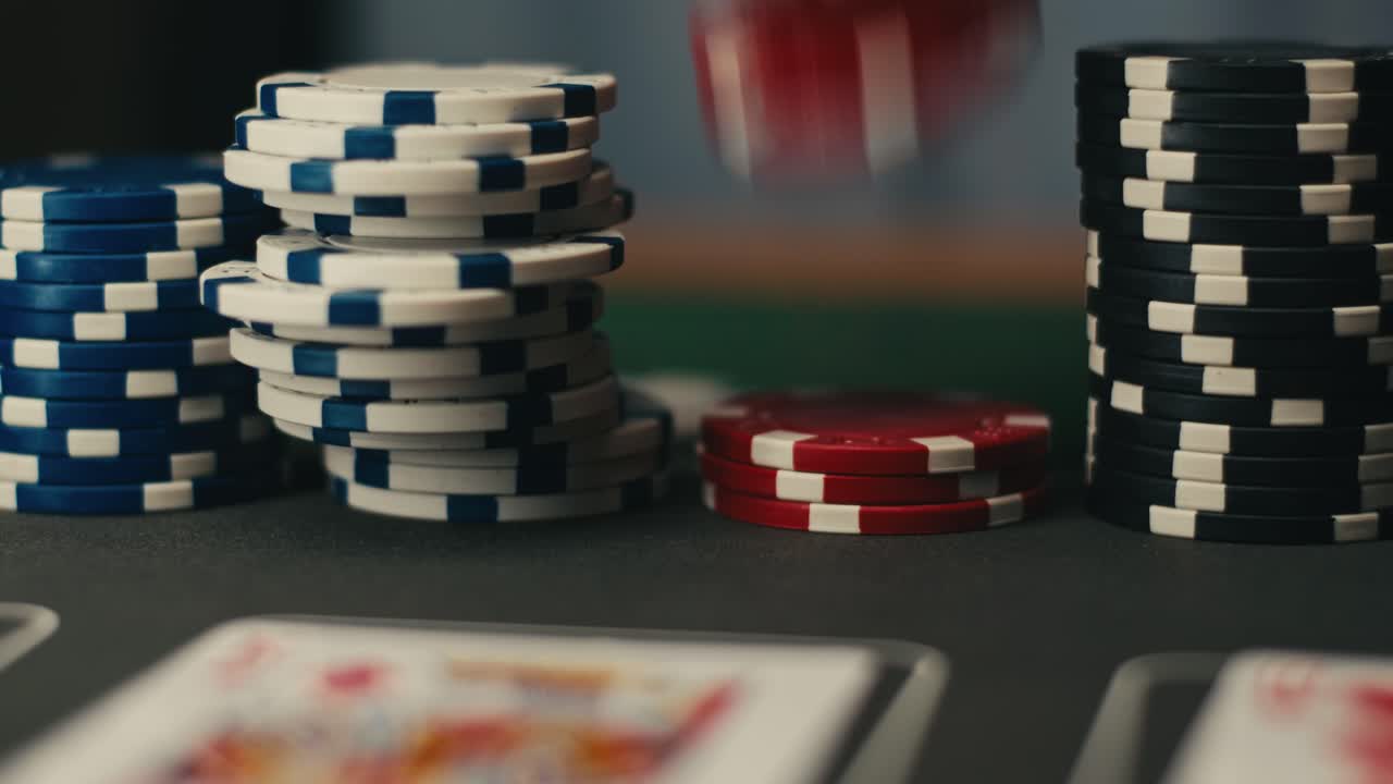 Close-up of poker chips and cards on a casino table