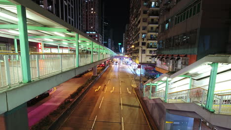 night timelapse of mong kok busy traffic on the road, hong kong