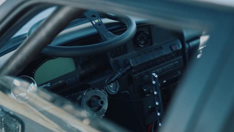 Slow-motion-shot-of-the-interior-of-a-drift-car-with-the-steering-wheel-taken-away