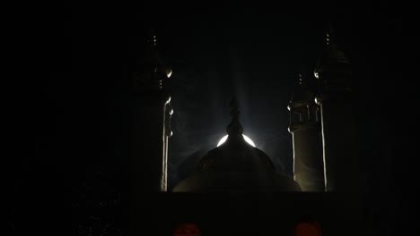 a realistic mosque miniature with windows at night. festive greeting card, invitation for muslim holy month ramadan kareem. selective focus