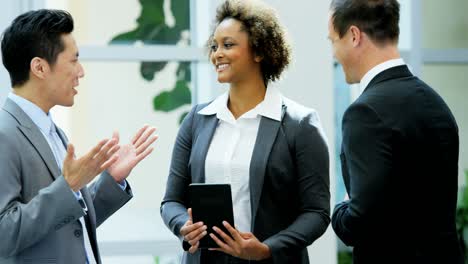 multi ethnic business team meeting with wireless tablet