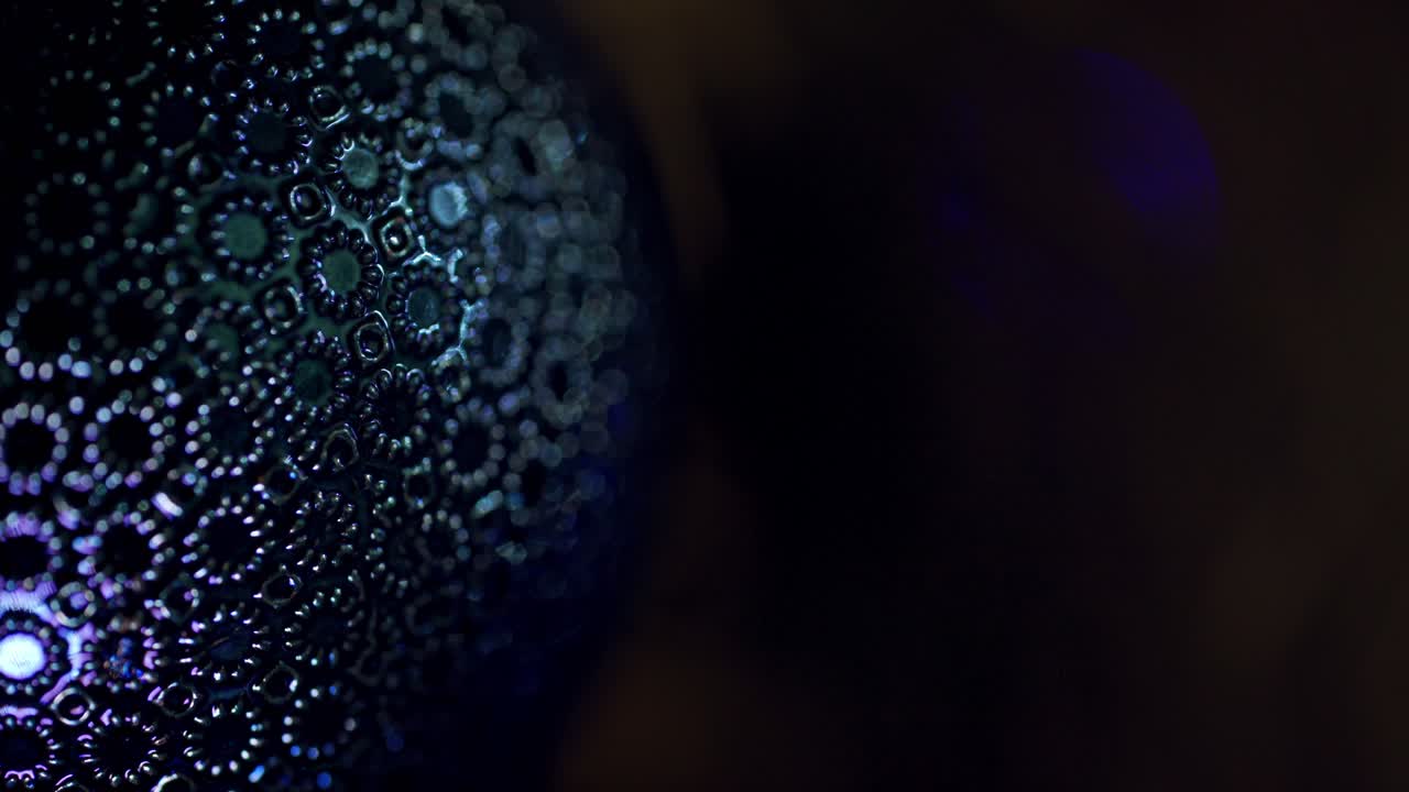 Christmas toy on blinking background. Some part of New year's decoration with blue light twinkling from the garland indoors.