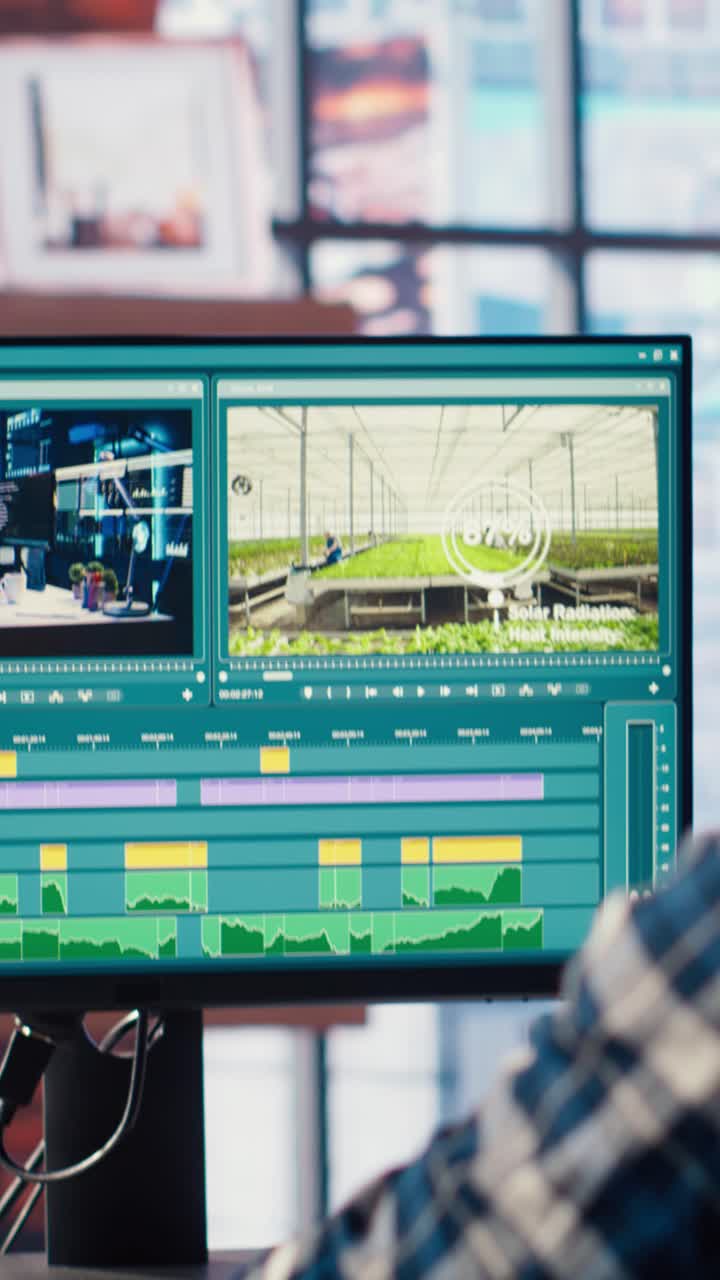 Vertical video Freelancer using editing tools on computer to cut movie project footage
