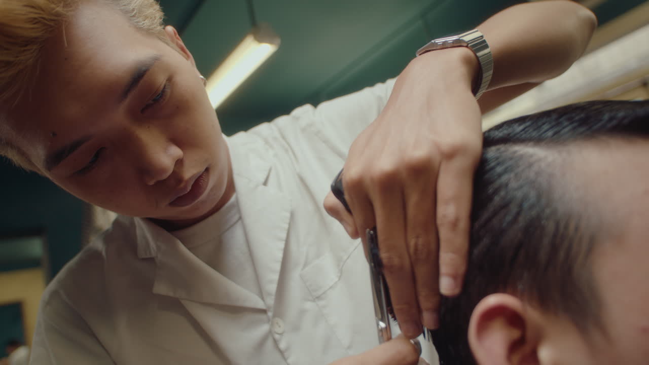 Barber Using Comb and Hairdressing Shears for Trimming Hair