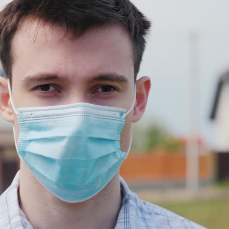 Portrait-Of-A-Young-Man-In-A-Protective-Medical-Mask