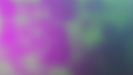 imagen borrosa y colorida con tonos púrpura y verde