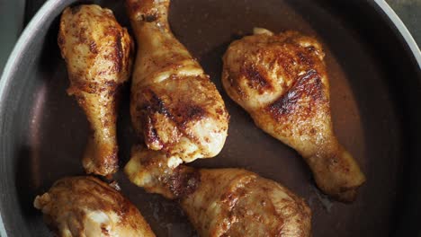 fried chicken legs in a pan