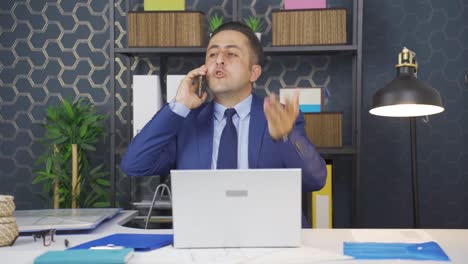 Businessman-making-angry-and-aggressive-call-on-the-phone.