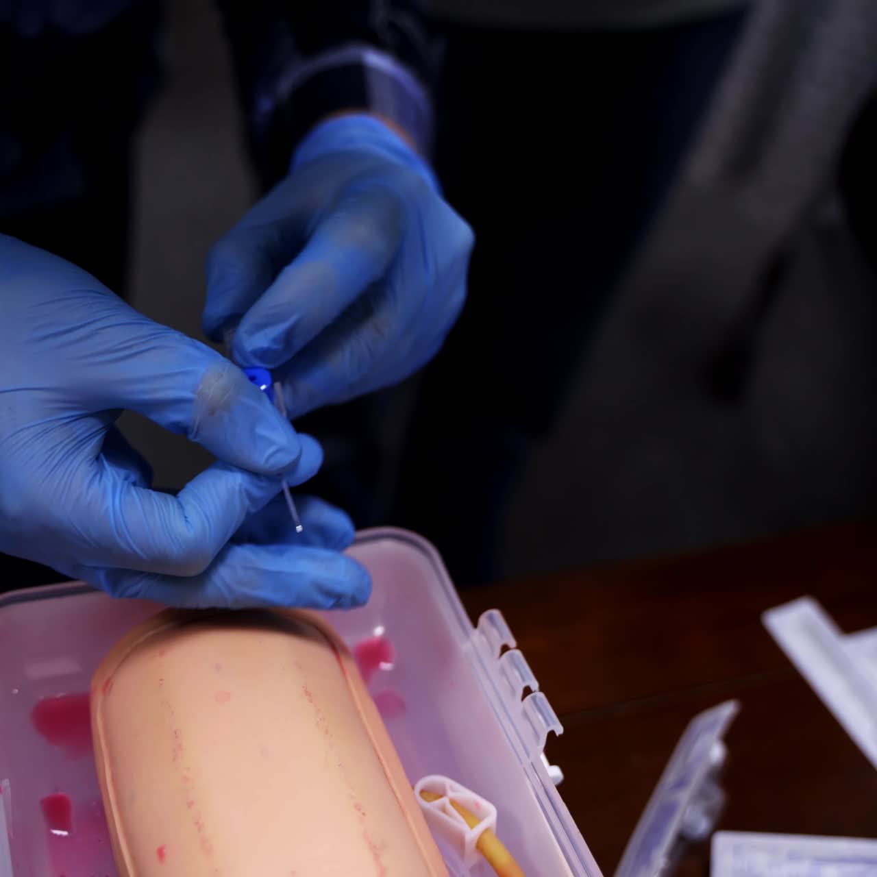 Training operation on a mannequin, closeup video. Medical training. Surgery operation on medical dummy