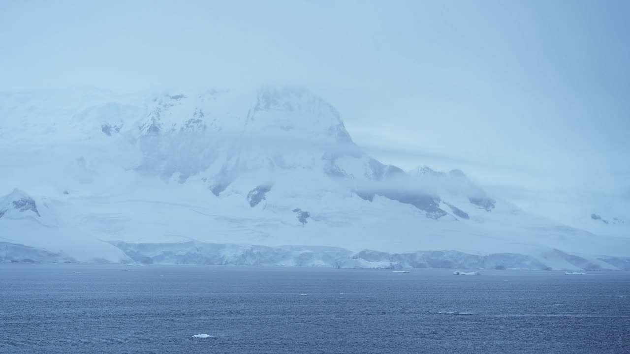 Winter Mountains and Glacier on Coast, Coastal Scenery in Antarctica, Cold Blue Landscape and Seascape with Glacier Ice and Ocean Sea Water, Antarctic Peninsula Beautiful Dramatic Coastline Scene