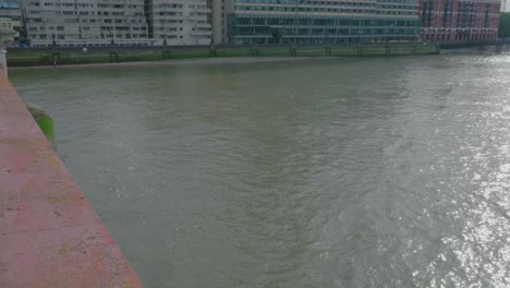 a look at the offices and apartment buildings in london located along the river thames