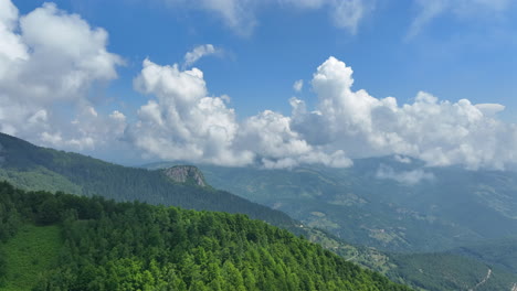 flight over green mountain peaks