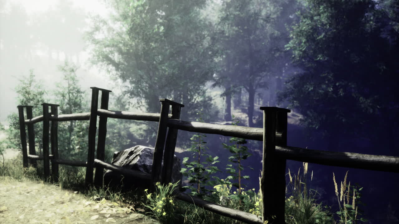 Serene woodland path with wooden fence and misty forest backdrop